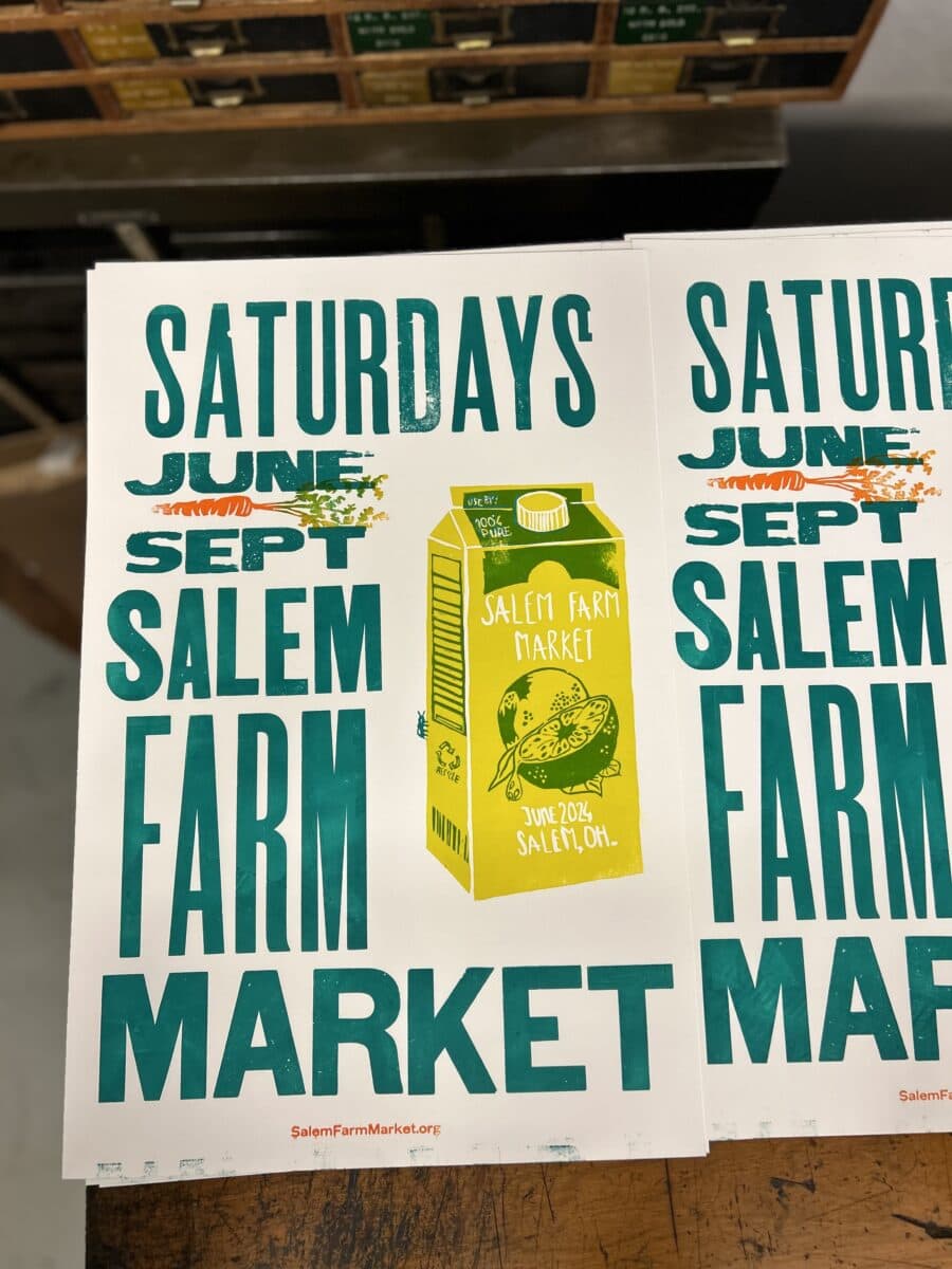 Printed posters advertising the Salem Farm Market held on Saturdays from June to September in Salem, Oklahoma, featuring a yellow carton illustration.